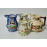 Various 19thC Staffordshire and other decroative jugs, to include a Staffordshire pink lustre design