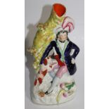 A 19thC Staffordshire flatback spill vase, of a gentleman huntsman aside dog and dead game,