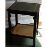 A mahogany two tier occasional table, the rectangular top with a green leather insert and a