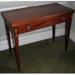 An early 19thC mahogany tea table, the rectangular top with a boxwood strung edge above a frieze