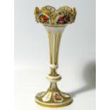 A 19thC Bohemian glass and enamel table lustre, the castellated top on an inverted stem