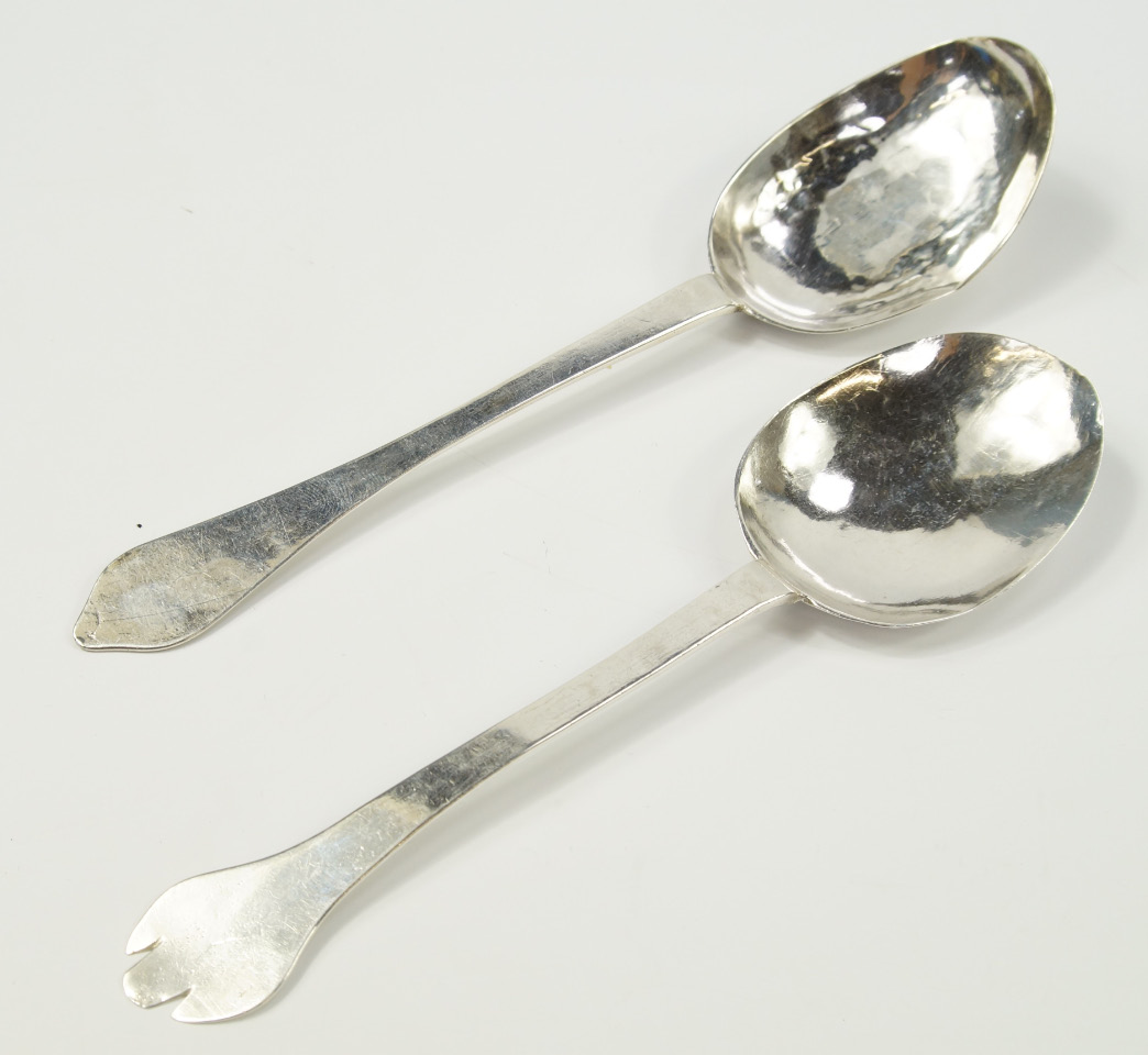 Two white metal trefid spoons, monogrammed and bearing dates for 1727 and 1728, 1.92oz.