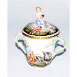 An early 20thC Naples Capo di Monte porcelain lidded chocolate cup, heavily decorated and raised