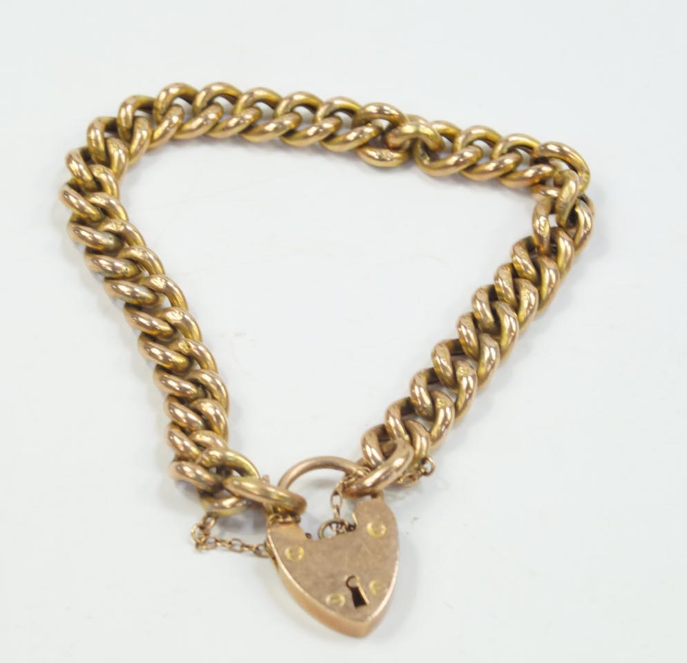 A hollow curb link bracelet, with padlock clasp, stamped 9C, 14.9g.