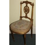 A late 19thC French gilt gesso side chair, the elaborate pierced back with a central oval