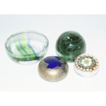 Paperweights and glass dish, being a Kerry glass green swirl, Isle of Wight blue and gilt, another