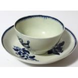 An 18thC blue and white porcelain tea bowl and saucer, 14cm dia., each decorated with an arrangement