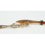 A bar brooch as a scimitar, set with coral and garnet stones to the handle, together with another