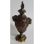 A Regency ormolu mounted rouge marble cassolette, of urn shaped design with goat's head mask