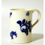 A late 18thC blue and white porcelain tankard, the cylindrical body decorated with fruits and