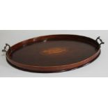 A 19thC Sheraton mahogany oval serving tray, with satinwood shell inlay and rosewood crossbanding,