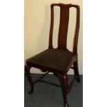 A walnut side chair, the splat with feather banding, with a drop in seat on cabriole legs with