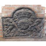 A large cast iron fire back, decorated with the Royal crest, 79cm high, 98cm wide.