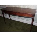 A George III mahogany bow fronted serving table, of plain form with square tapering legs, 90cm high,