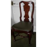 A walnut side chair, with a shaped solid splat, a drop in seat on cabriole legs with H-stretcher and