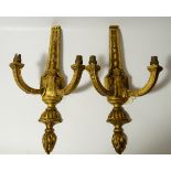 A pair of Neo-Classical design giltwood wall lights, 62cm high.