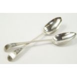 A pair of George III silver serving spoons, with bright cut decoration, monogrammed reserve,