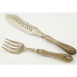 A pair of Victorian silver fish servers, with floral and foliate decoration, Martin Hall & Co,