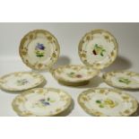 An early 19thC porcelain part dessert service, comprising shaped serving dish, 28cm wide and seven
