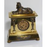 A 19thC gilt brass Egyptian Revival mantel clock, with eight day French movement striking a bell,