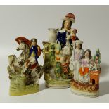 Three various 19thC Staffordshire figures, to include equestrian figure, 19cm high, clock group etc.