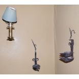 Two wrought iron wall mounted oil lamps, and a brass wall lamp fitted for electricity (3).