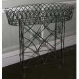 A 19thC wirework rectangular jardiniere, with shaped sides and an undertier, 75cm wide.