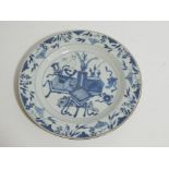 An 18thC English blue and white Delft tin glazed plate, the circular body decorated with Oriental