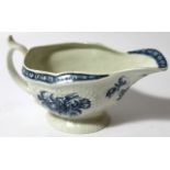 An 18thC Worcester blue and white porcelain sauceboat, with textured slipper body and 'C' scroll ear