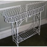 A 19thC style wirework rectangular jardiniere, with shaped sides and an undertier, 102cm wide.