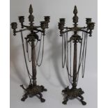 A pair of 19thC silver plated candelabra, with four branch/five light top, with chains around a
