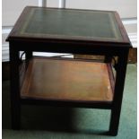 A mahogany two tier low table, with a green leather insert above a moulded edge on chamfered legs