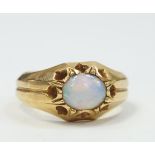 A gentleman's signet ring, set with an opal, marked 18C, 7.7g all in.