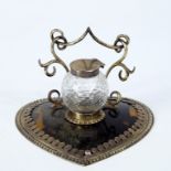 An Edwardian ladies heart shaped tortoiseshell and silver desk stand, with ink well, maker Geo Young