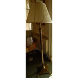 An early 19thC brass floor lamp, with a reeded Corinthian column, the square base applied with
