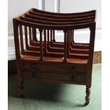 A mahogany Canterbury in George III style, with four slatted divisions above two frieze drawers on