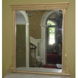 A 19thC gilt gesso overmantel mirror, with rectangular plate, the frame moulded with leaves and