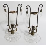 A pair of Victorian gilt metal framed vase or candle holders, with glass dome bases and drops,