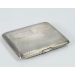 A George V engine turned silver cigarette case, Chester 1938, 4oz.