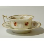 A 19thC English porcelain cabinet cup and saucer, 17cm wide,each of shaped outline decorated with