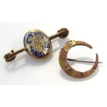 An early 20thC crescent shaped brooch, engraved with scrolls with a plain pin back, Continental