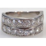 A 20thC two row diamond half eternity ring, comprising eighteen brilliant cut diamonds in two rows