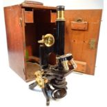 An early 20thC Henry Crouch London microscope, no. 10135 with articulated brass turnings and lens on