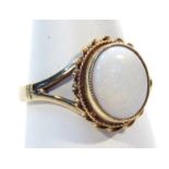A ladies dress ring, set with oval opal part pierced shank with rope twist outline, yellow metal,