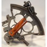 A 20thC metal framed naval sextant, of typical outline with polished wooden handle and articulated