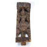 An Indian Kadi style hardwood carving, of a figure with arms outstretched, with a concaved back