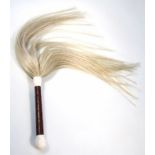 A modern African design fly swot, with horse hair style end and wooden handle with bone mounts,