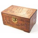 A hardwood jewellery casket, with rectangular outline heavily carved to the body and lid with