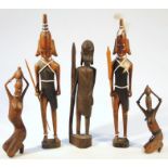 Various 20thC carved hardwood African tribal figures, to include a lady in a flowing dress stood