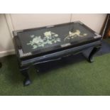 A 20thC oriental design coffee table, the rectangular top centred with raised mother of pearl finish